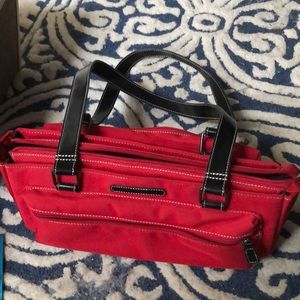 Red Camera Case.  Shoulder straps.  Zipper on top.